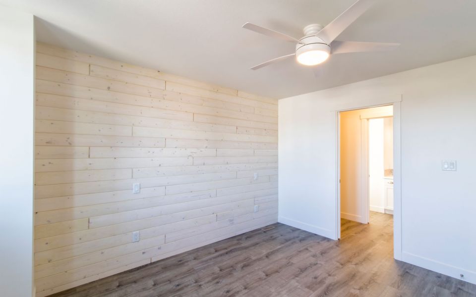room with wood feature wall